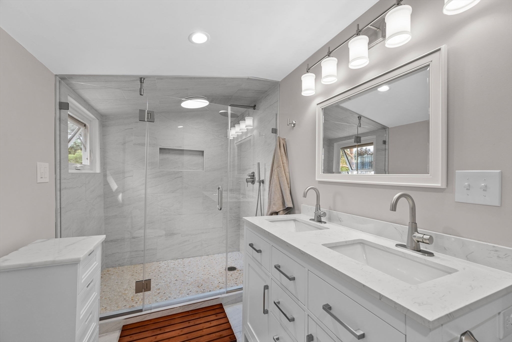 44 Peach Highlands Marblehead, MA 01945 - Photo 30 of 41 a bathroom with double vanity sink a toilet a mirror and shower