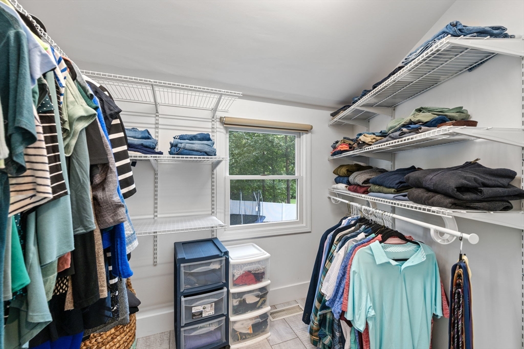 44 Peach Highlands Marblehead, MA 01945 - Photo 33 of 41 a view of walk in closet with clothes and shoes
