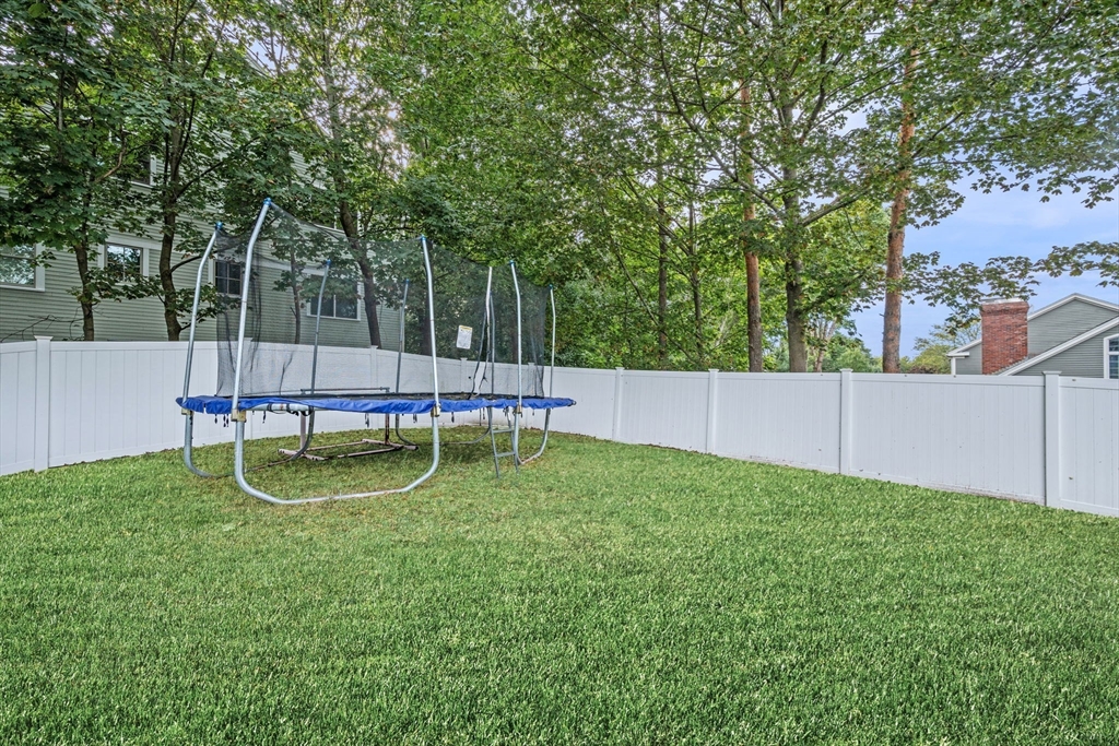 44 Peach Highlands Marblehead, MA 01945 - Photo 38 of 41 a backyard of a house with childrens swings and slides