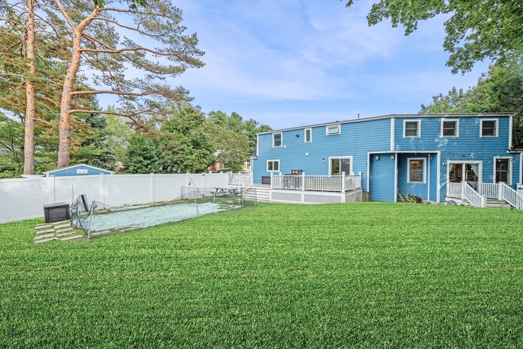 44 Peach Highlands Marblehead, MA 01945 - Photo 39 of 41 a backyard of a house with table and chairs