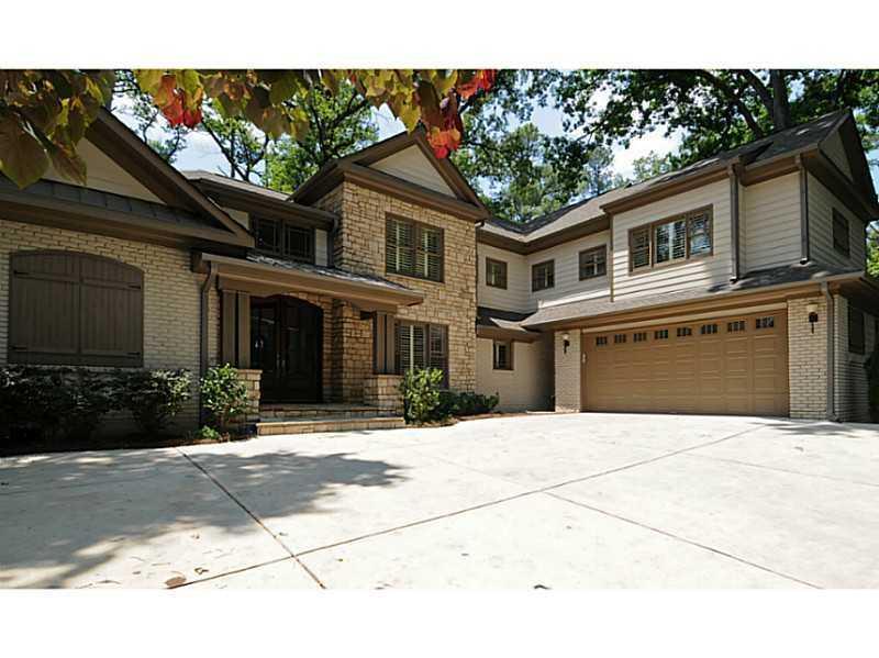 3036 West Roxboro Road Northeast Atlanta, GA 30324 - Photo 1 of 1 a front view of a house with a garden