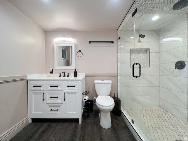 3138 Jean Street Magna, UT 84044 - Photo 17 of 26 Modern bathroom featuring dark wood-finish flooring and a neutral color palette