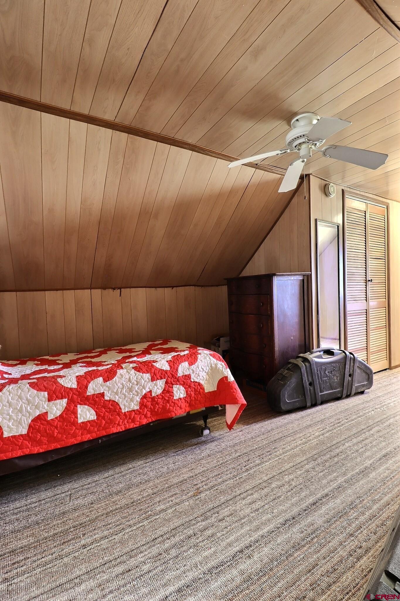 21148 H75 Road Delta, CO 81416 - Photo 13 of 30 a bedroom with a bed and a dresser