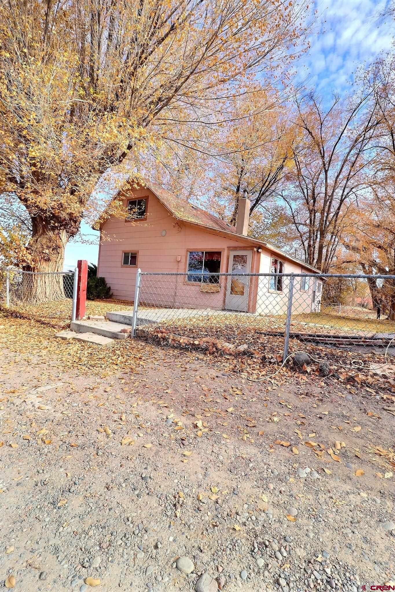 21148 H75 Road Delta, CO 81416 - Photo 18 of 30 front view of a house with a yard