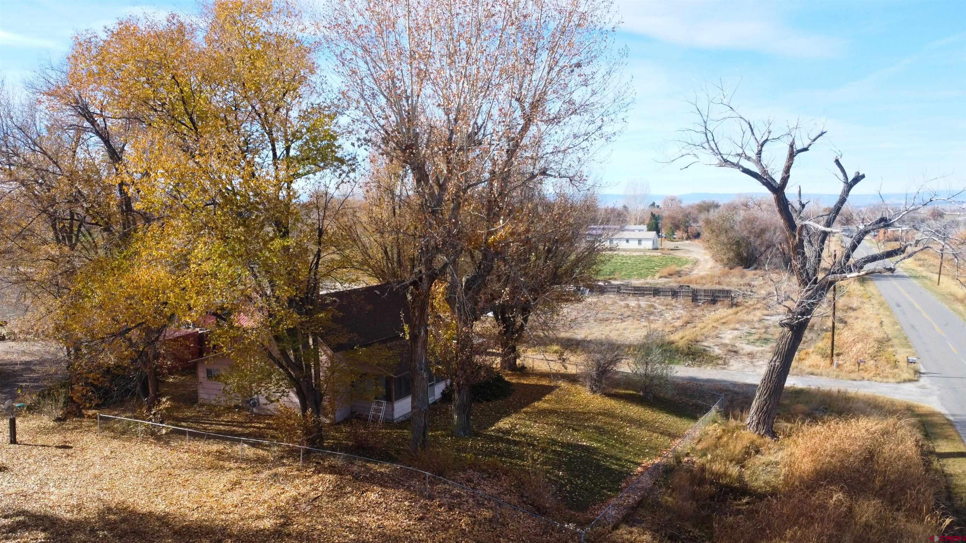 21148 H75 Road Delta, CO 81416 - Photo 19 of 30 a backyard of a house with lots of green space