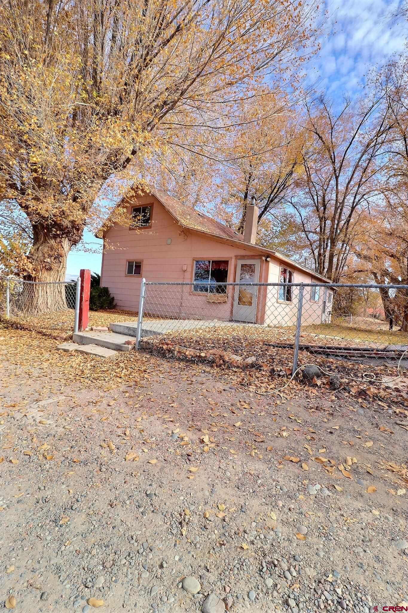 21148 H75 Road Delta, CO 81416 - Photo 20 of 30 front view of a house with a yard