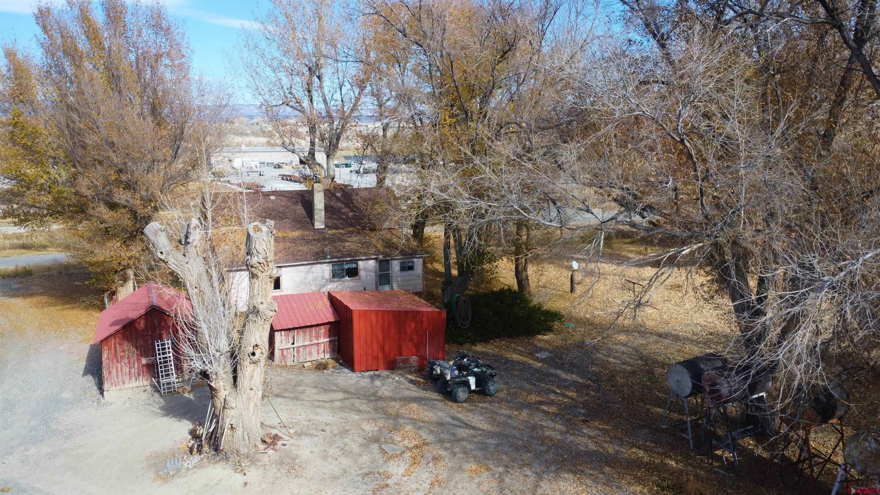 21148 H75 Road Delta, CO 81416 - Photo 21 of 30 a backyard of a house with outdoor seating
