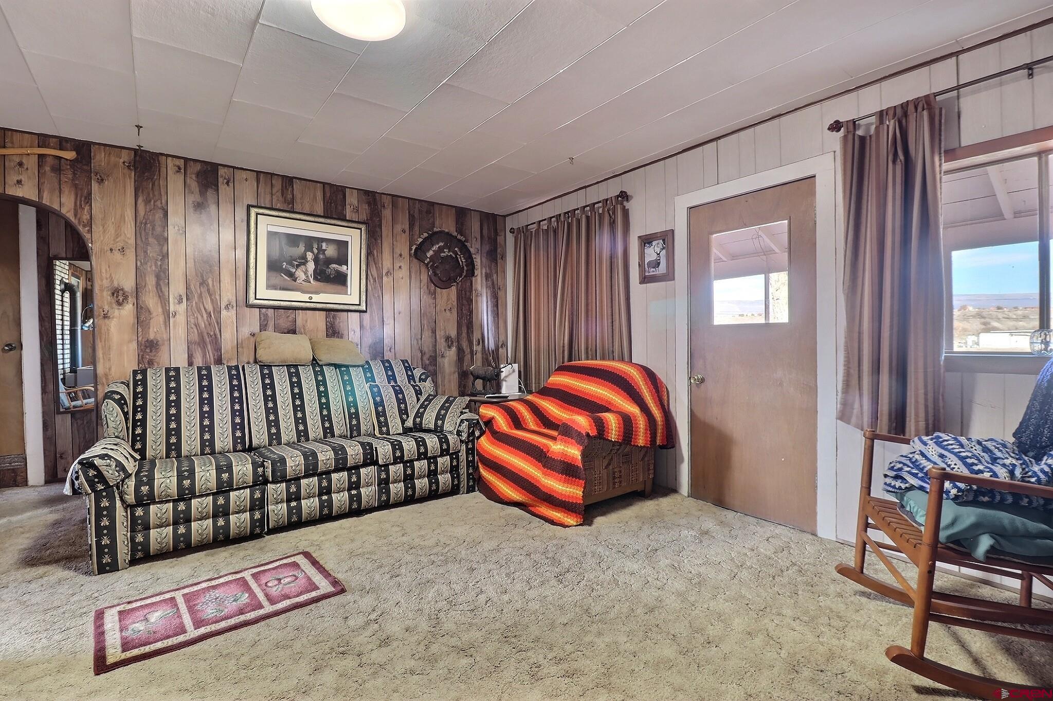 21148 H75 Road Delta, CO 81416 - Photo 24 of 30 a bedroom with a bed and a couch