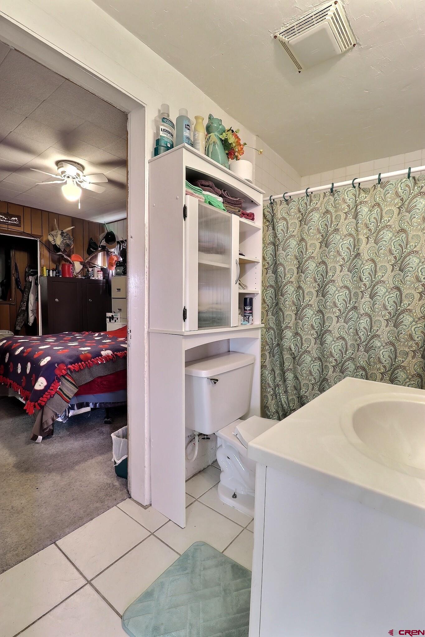 21148 H75 Road Delta, CO 81416 - Photo 7 of 30 a bedroom with a bed and a large window