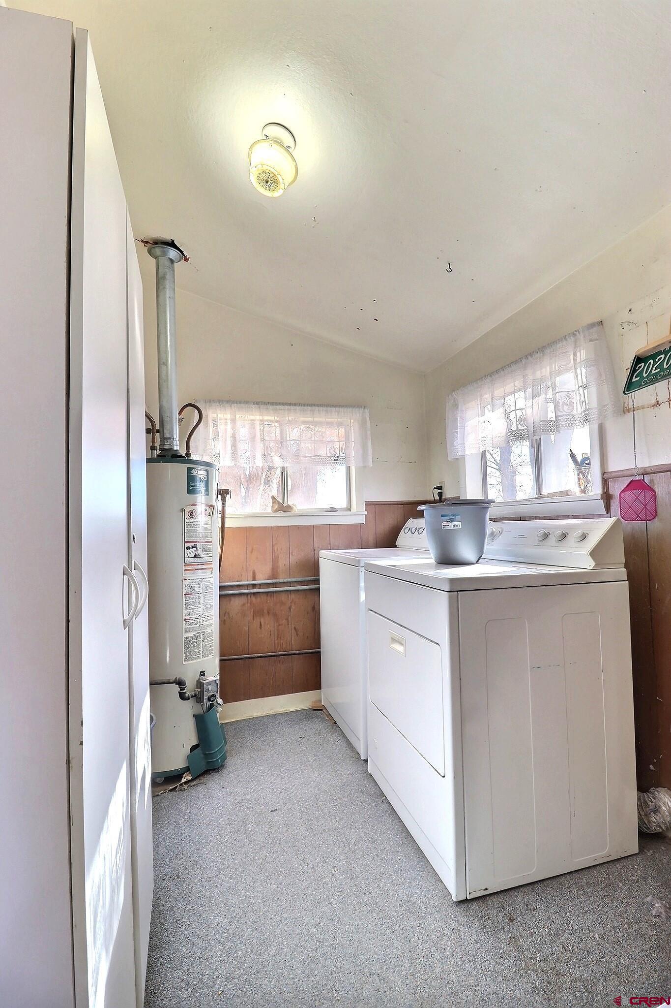 21148 H75 Road Delta, CO 81416 - Photo 10 of 30 a kitchen with cabinets and a refrigerator