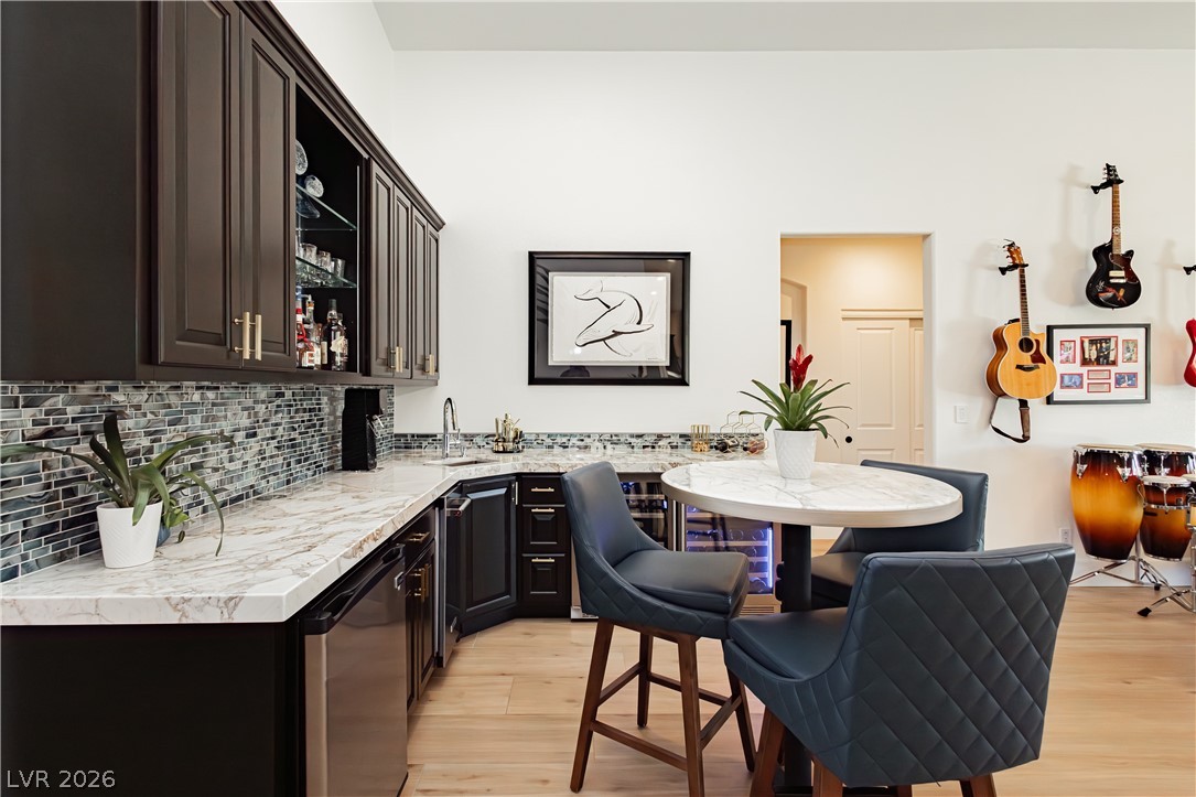 2256 Dogwood Ranch Avenue Henderson, NV 89052 - Photo 26 of 51 A well-appointed wet bar with ample counter space and stylish seating invites lively entertainment.
