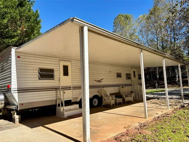 a kitchen with stainless steel appliances a stove a sink and a refrigerator