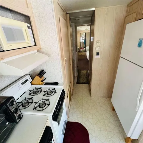 a bedroom with a bed and a television