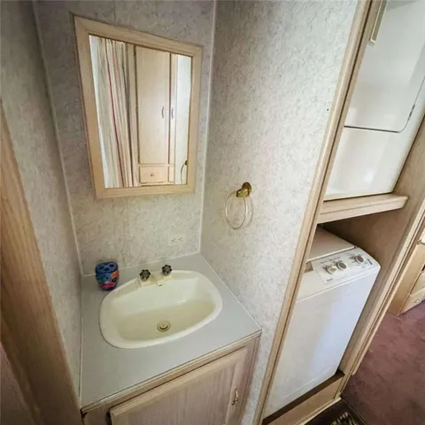 a view of a yard with yellow house