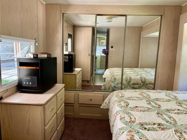a view of a patio with a table and chairs