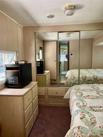 a view of a swimming pool with chairs in patio