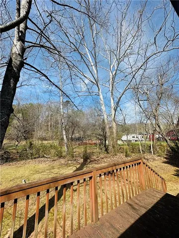 a backyard of a house with lots of green space