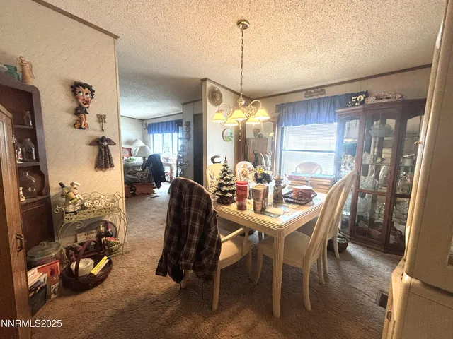 a very nice looking living room with furniture and a mirror