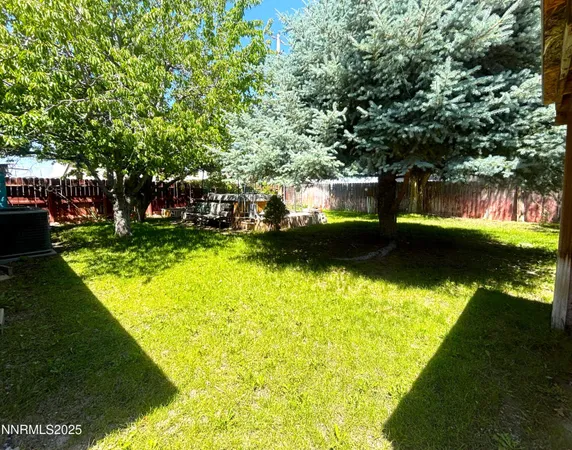 a kitchen with stainless steel appliances a sink a stove top oven a counter space and cabinets