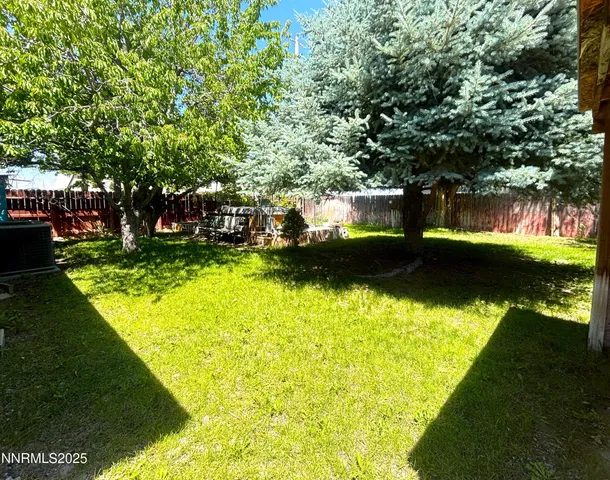 a kitchen with stainless steel appliances a sink a stove top oven a counter space and cabinets