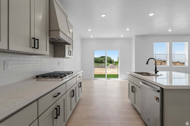 2816 West Aurora Avenue Mapleton, UT 84664 - Photo 6 of 20 Kitchen featuring stainless steel appliances, light stone counters, gray cabinetry, light wood finished floors, and recessed lighting