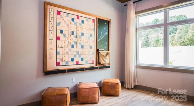 a view of a livingroom with furniture and a window