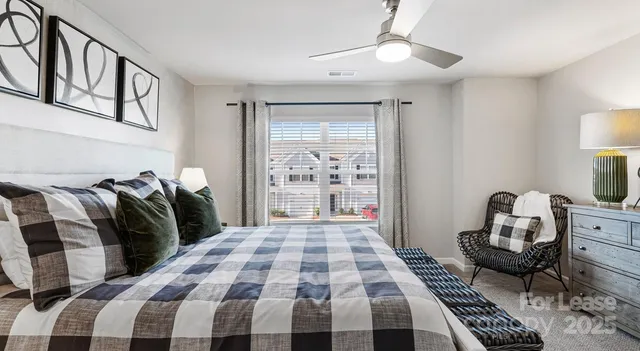 a bedroom with double bed and a window