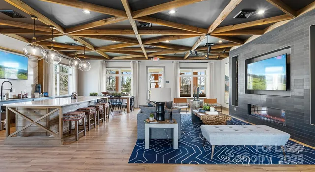 a living room with lots of furniture and a table