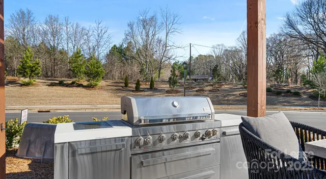 a view of a patio with iron fence