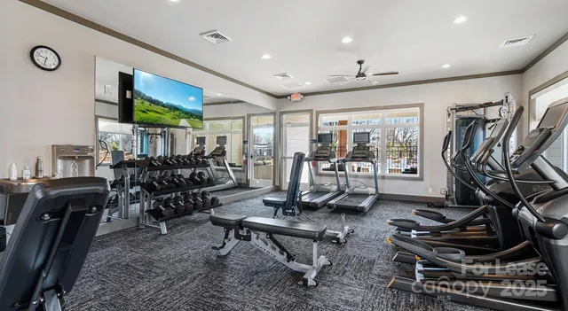 a living room with lots of furniture and a flat screen tv