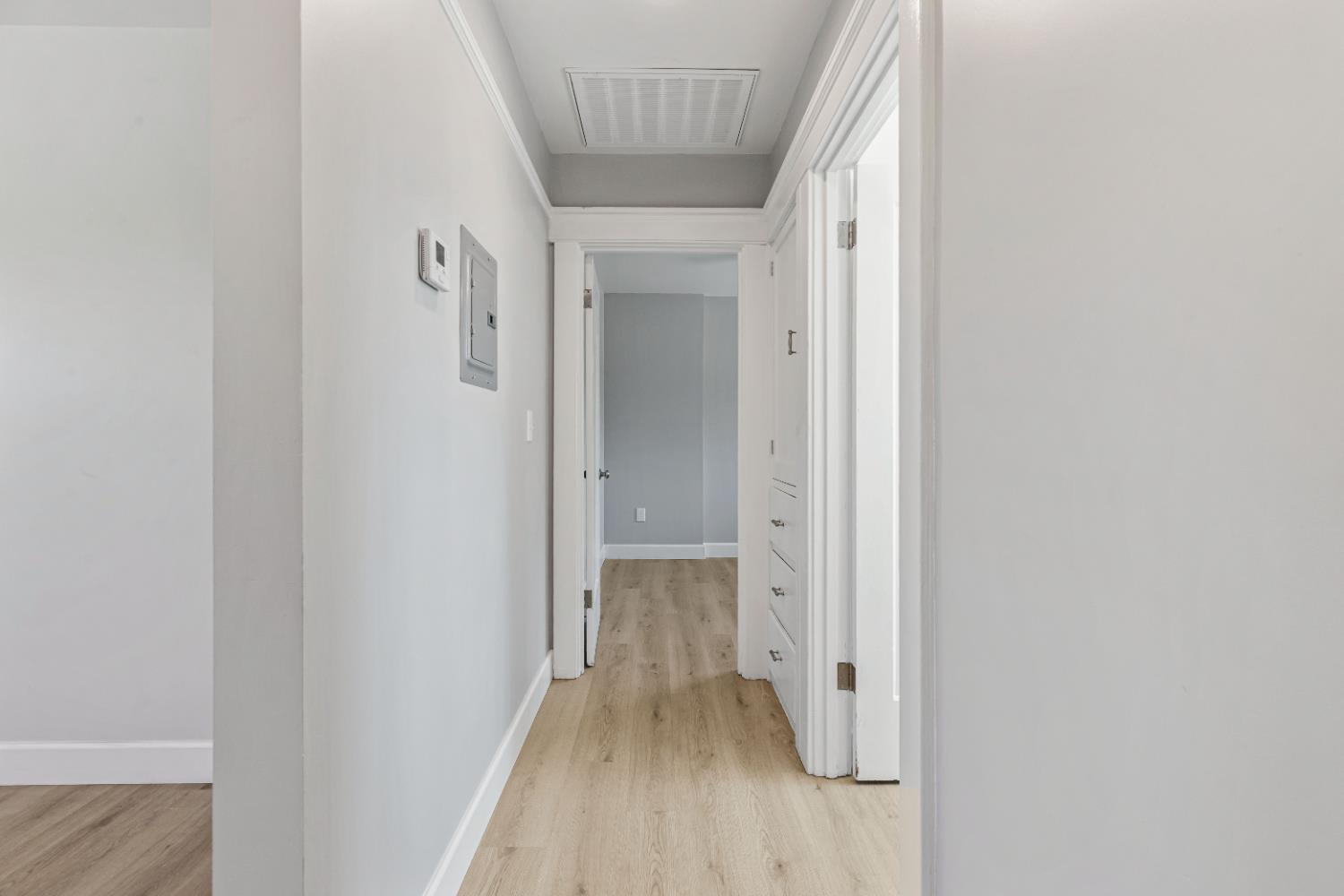 12484 South Union Road Manteca, CA 95336 - Photo 14 of 38 a view of a hallway with wooden floor