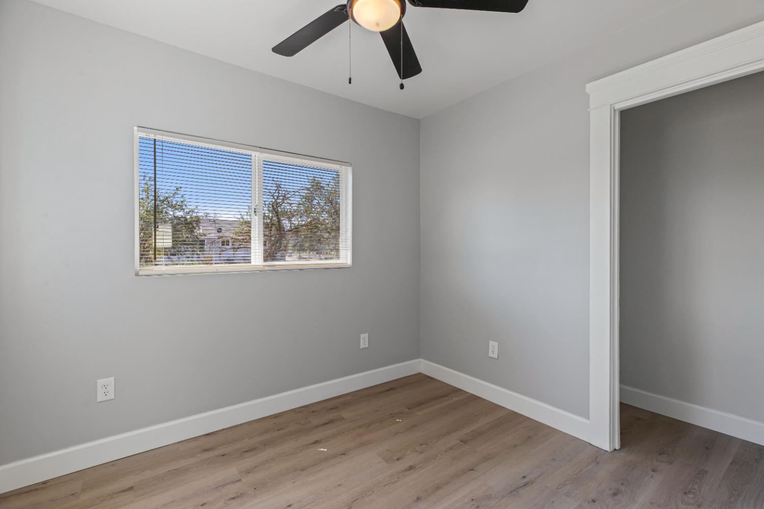 12484 South Union Road Manteca, CA 95336 - Photo 25 of 38 wooden floor in an empty room with a window