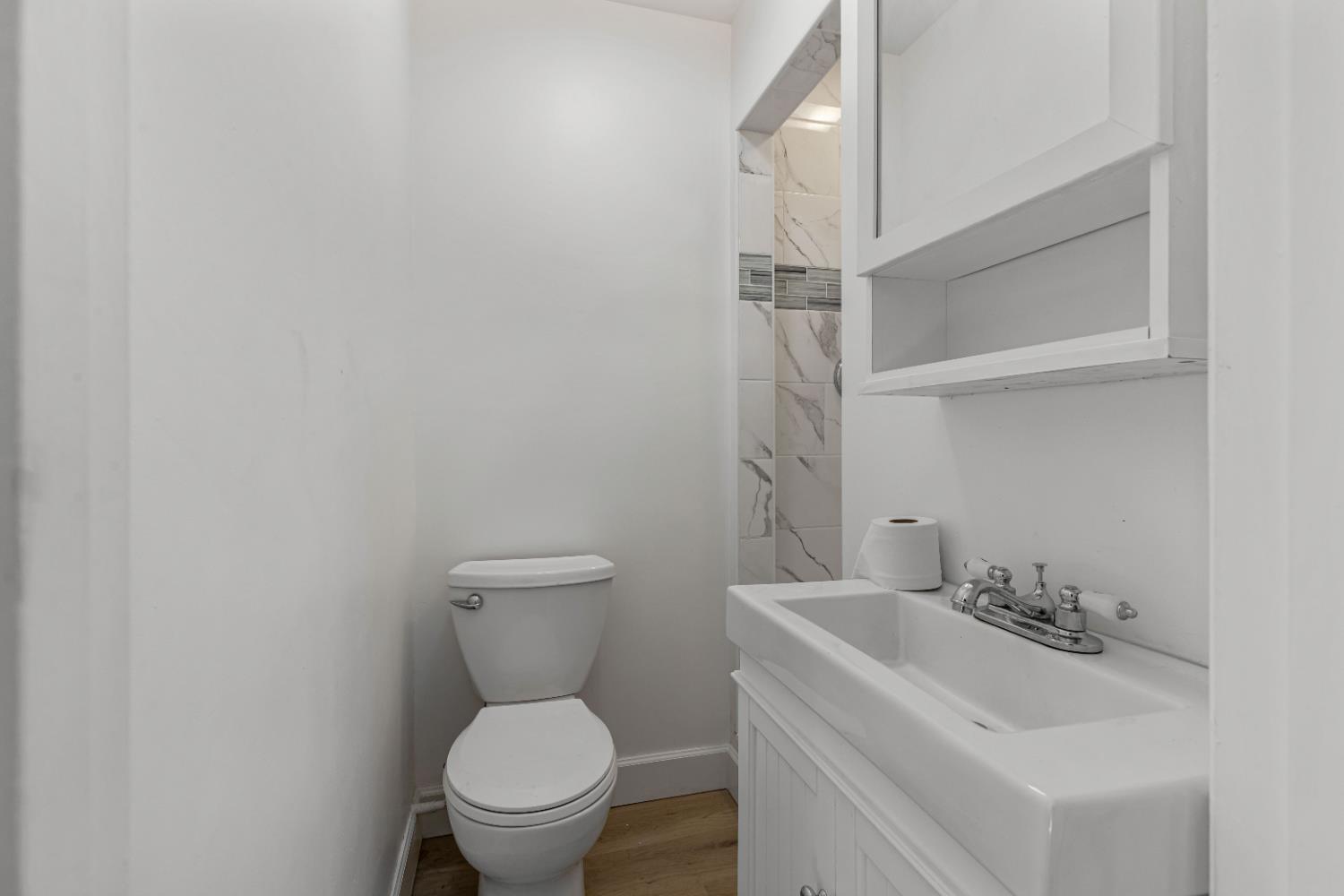 12484 South Union Road Manteca, CA 95336 - Photo 27 of 38 a bathroom with a sink toilet and a mirror