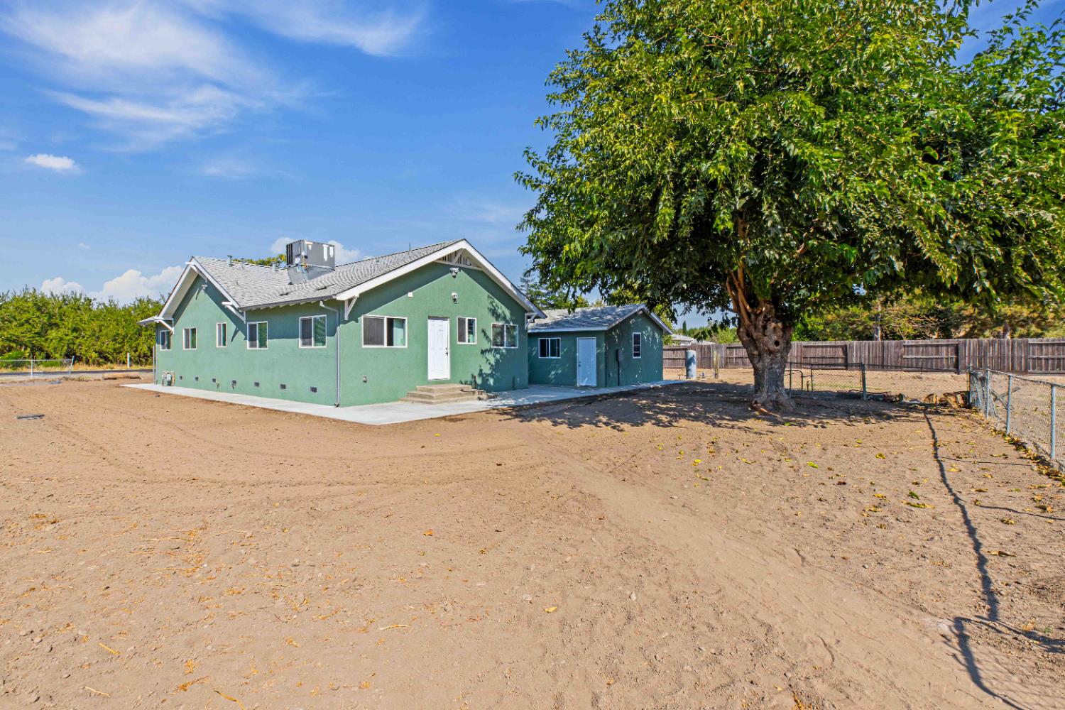 12484 South Union Road Manteca, CA 95336 - Photo 32 of 38 a front view of a house with a yard and garage