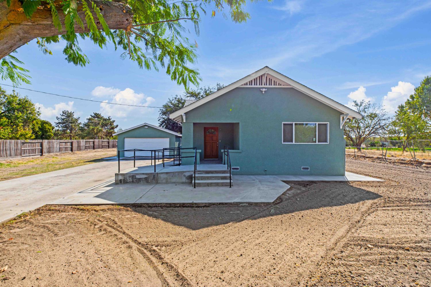 12484 South Union Road Manteca, CA 95336 - Photo 4 of 38 a view of a house with a yard