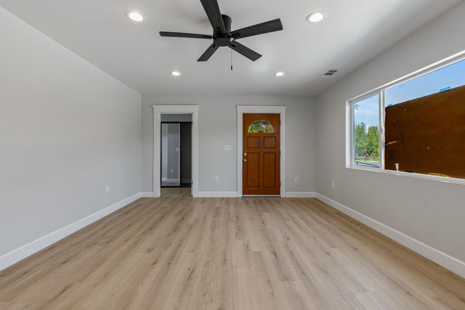 12484 South Union Road Manteca, CA 95336 - Photo 8 of 38 wooden floor in an empty room with a window