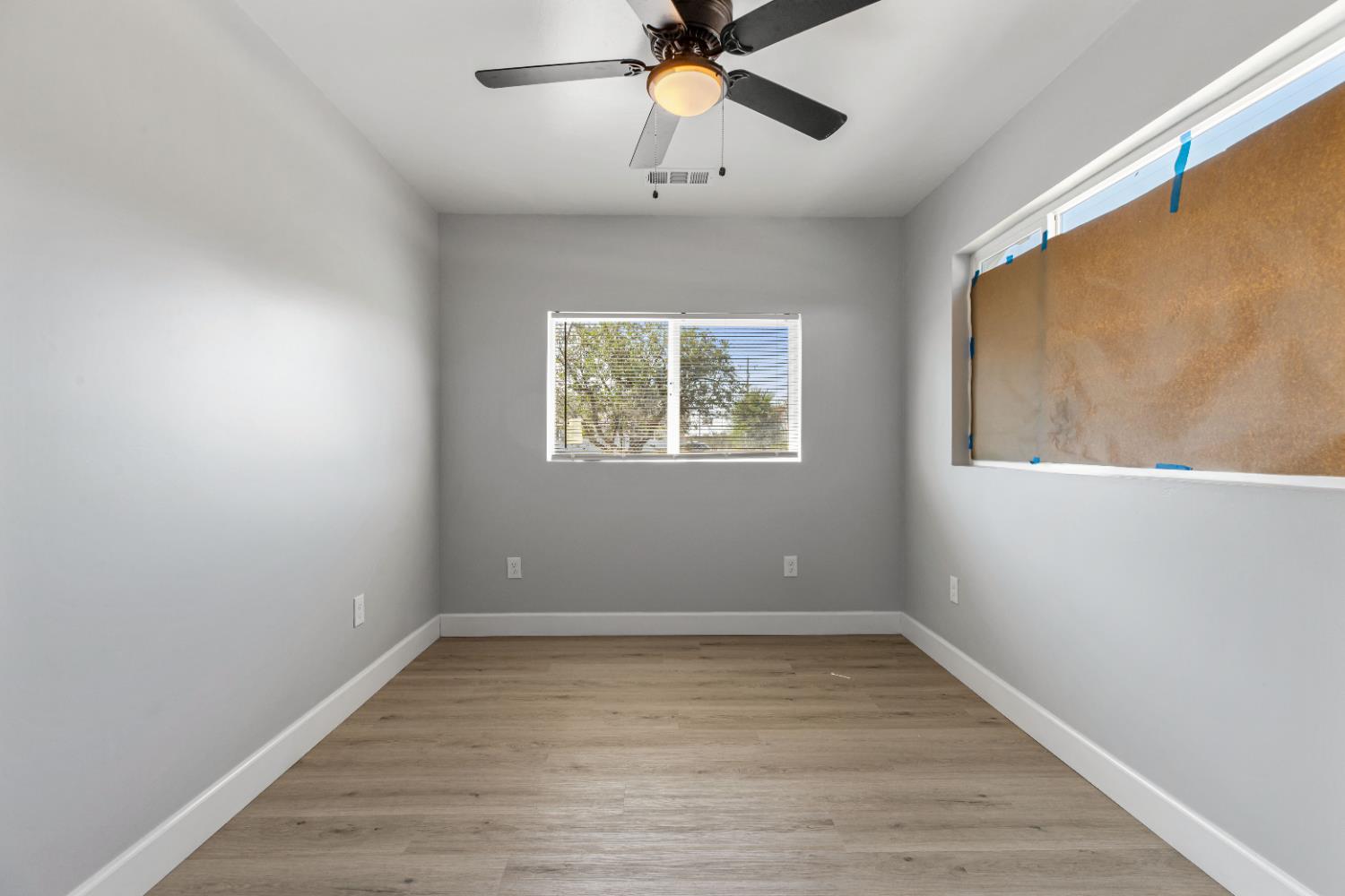 12484 South Union Road Manteca, CA 95336 - Photo 9 of 38 a view of room with window and ceiling fan