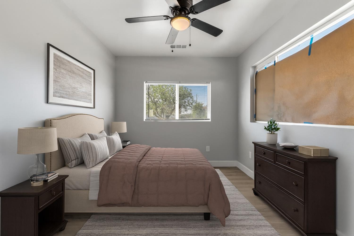 12484 South Union Road Manteca, CA 95336 - Photo 10 of 38 a bedroom with a bed and a chandelier