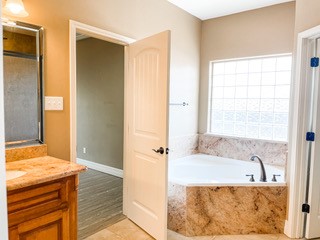 1306 Keenland Road Corpus Christi, TX 78418 - Photo 25 of 26 a bathroom with a tub and a shower