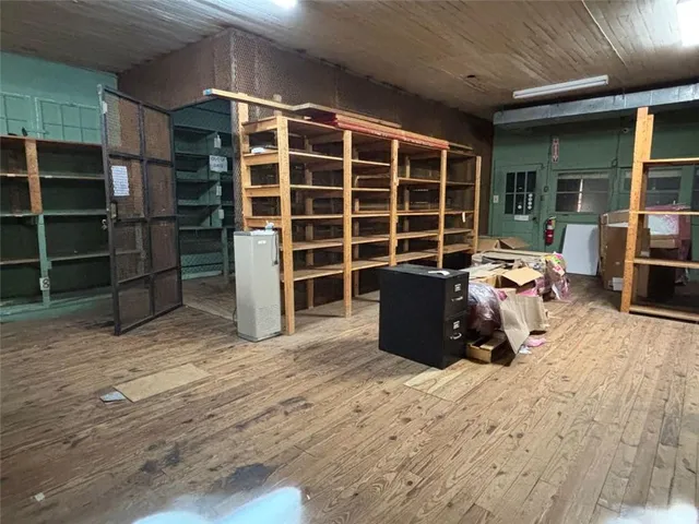 a view of walk in closet with empty racks