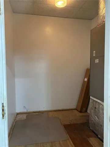 a view of an empty room and wooden floor