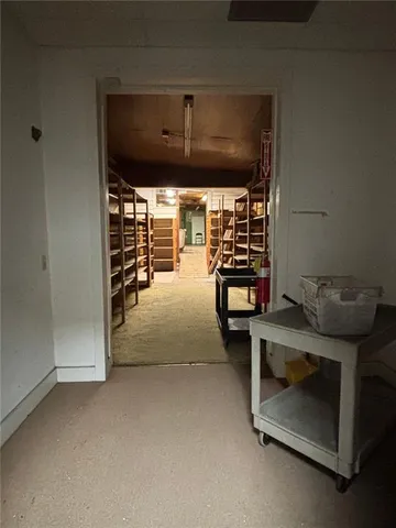 a view of room with stairs and a chair