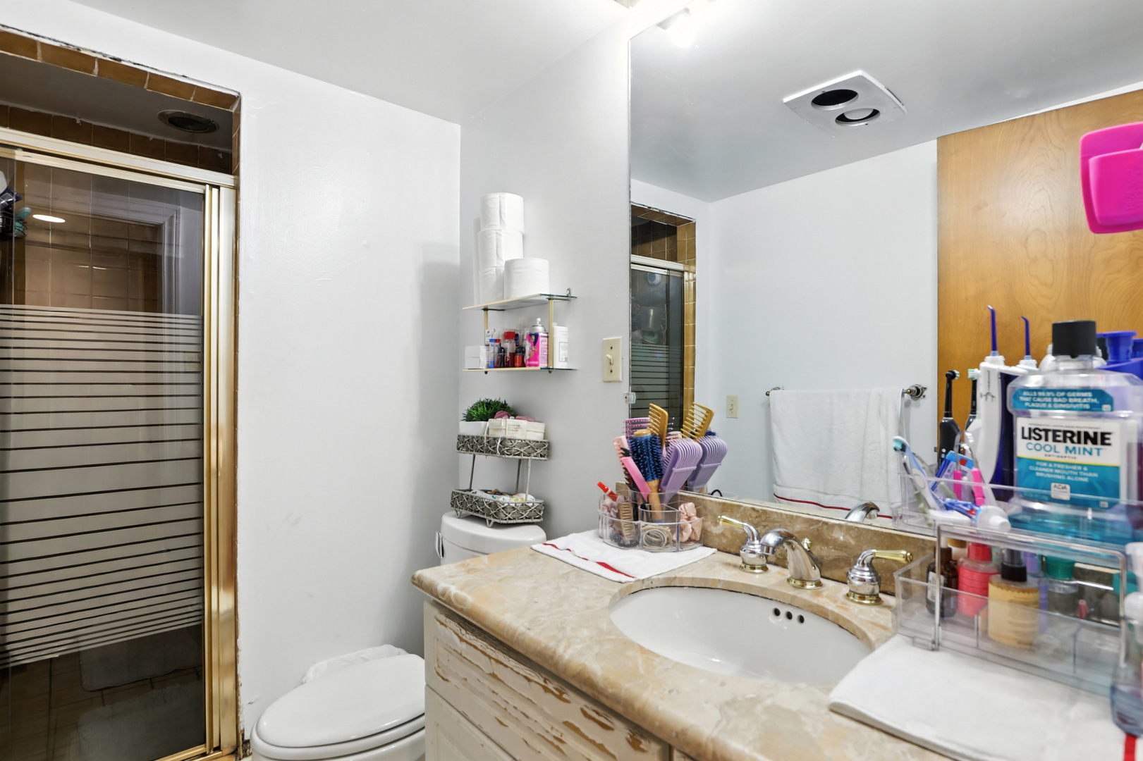 3814 Sherwin Avenue Lincolnwood, IL 60712 - Photo 11 of 21 a bathroom with a granite countertop toilet sink and mirror