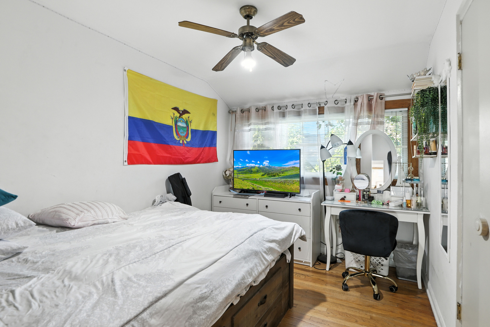 3814 Sherwin Avenue Lincolnwood, IL 60712 - Photo 13 of 21 a bedroom with a bed window and a flat screen tv