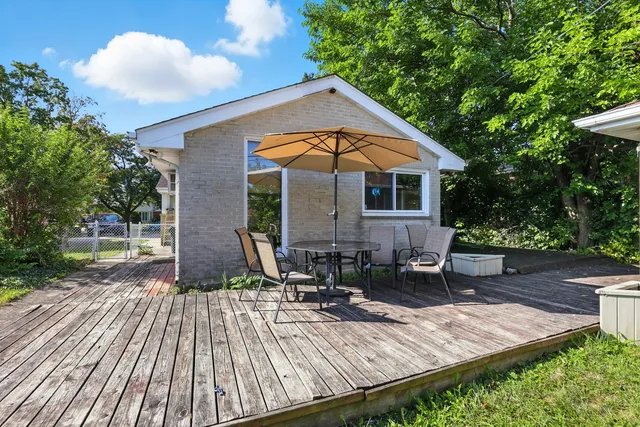 a front view of house with yard seating and green space