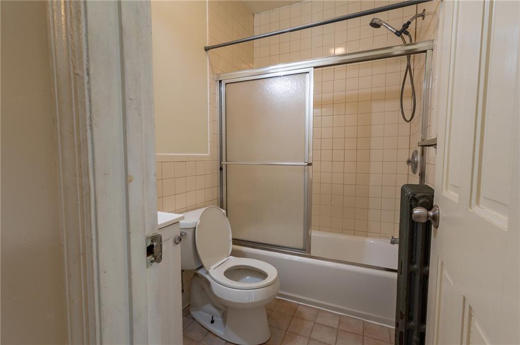 832 Broadway Avenue McKees Rocks, PA 15136 - Photo 14 of 48 a bathroom with a shower and toilet