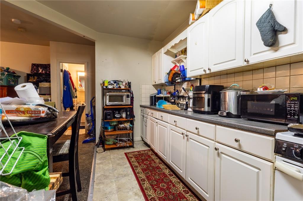 832 Broadway Avenue McKees Rocks, PA 15136 - Photo 19 of 48 a kitchen with stainless steel appliances granite countertop a refrigerator and a stove