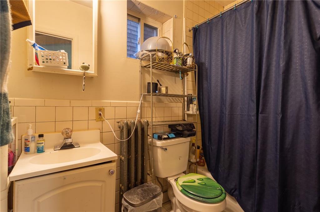 832 Broadway Avenue McKees Rocks, PA 15136 - Photo 20 of 48 a bathroom with a toilet and a sink