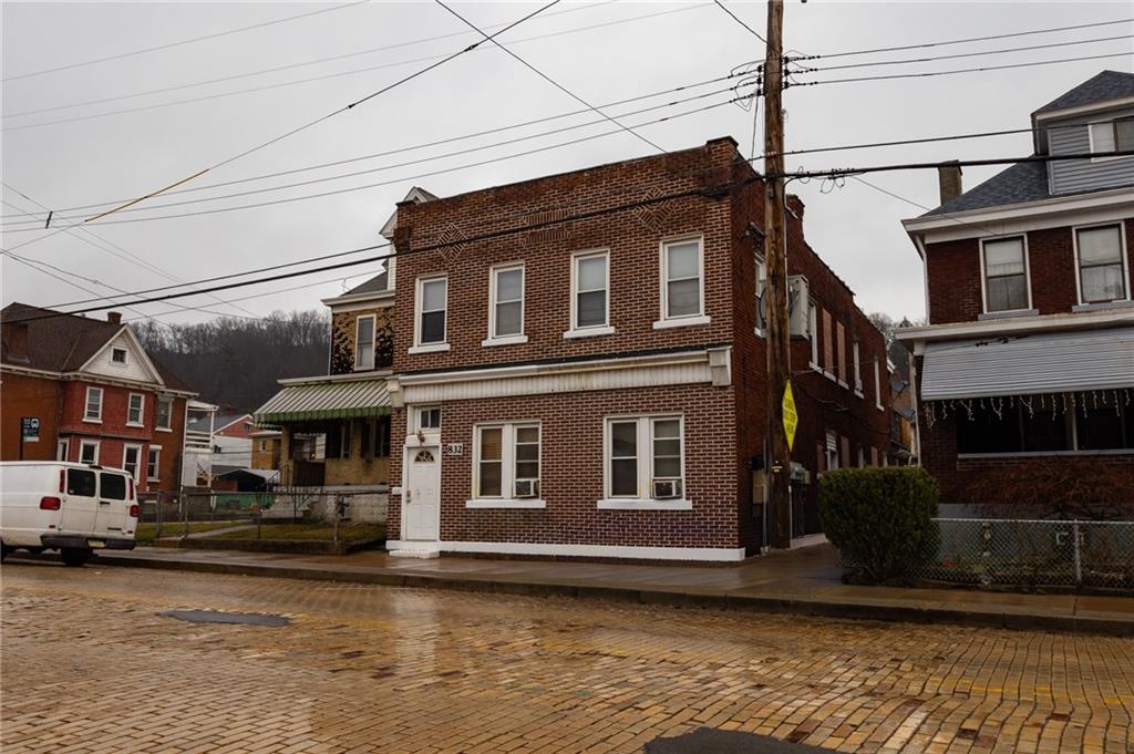 832 Broadway Avenue McKees Rocks, PA 15136 - Photo 2 of 48 a front view of a building with pool