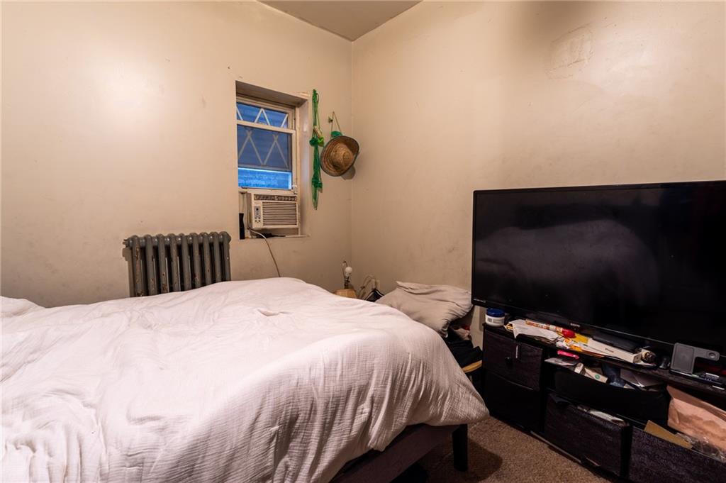 832 Broadway Avenue McKees Rocks, PA 15136 - Photo 21 of 48 a bedroom with a bed and a flat screen tv